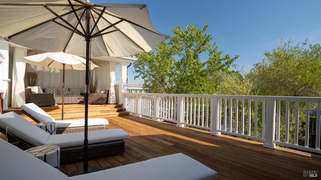 wooden deck featuring outdoor lounge area
