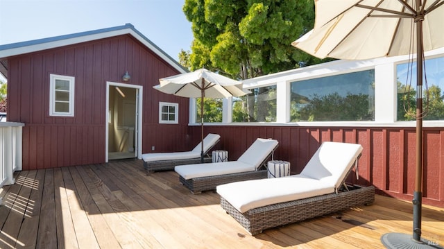 wooden terrace with an outbuilding