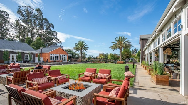 view of patio featuring an outdoor living space with a fire pit