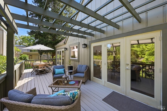 wooden deck with french doors, outdoor dining space, and a pergola