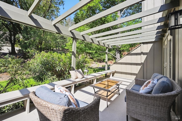 view of patio with an outdoor living space and a pergola