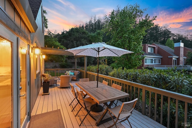 deck with outdoor dining area