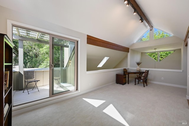 interior space featuring carpet flooring, baseboards, and vaulted ceiling with beams