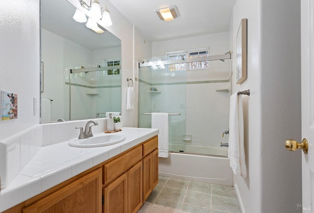 full bathroom with vanity and shower / bath combination with glass door