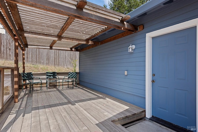 deck featuring fence and a pergola