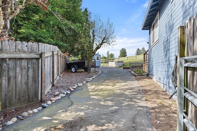 view of road featuring aphalt driveway