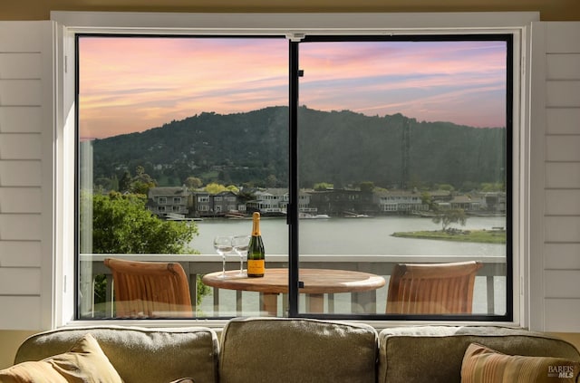 doorway to outside with a water view