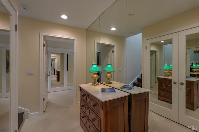 interior space featuring light carpet and french doors
