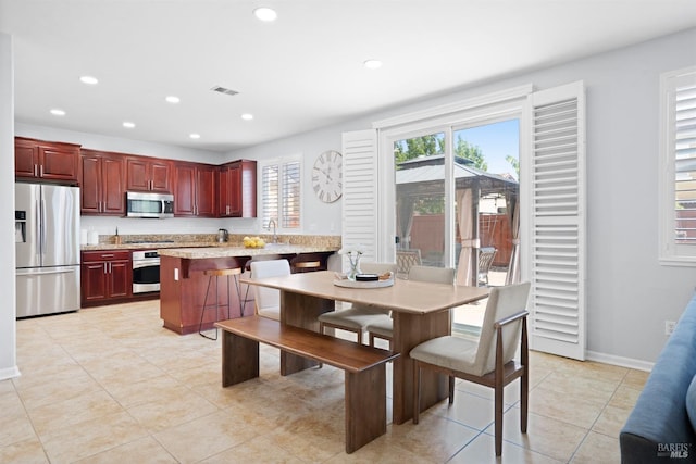 dining area with light tile patterned floors, recessed lighting, baseboards, and visible vents