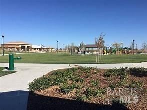 surrounding community featuring a yard