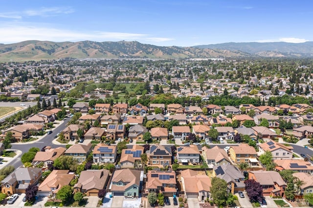 birds eye view of property with a residential view and a mountain view