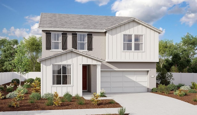 view of front of property featuring concrete driveway, board and batten siding, fence, and a garage