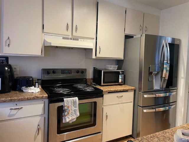 kitchen with under cabinet range hood, appliances with stainless steel finishes, and white cabinetry