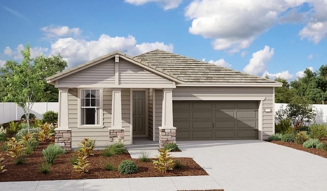 view of front of house featuring fence, a garage, and driveway