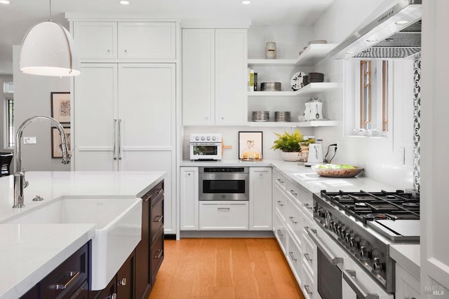 1071 Bale Ln, Calistoga, CA 94515 - kitchen featuring white cabinetry, wall chimney exhaust hood, and a sink