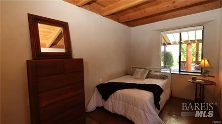 bedroom featuring beamed ceiling