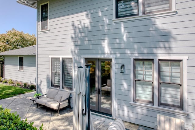 doorway to property with a patio area and french doors