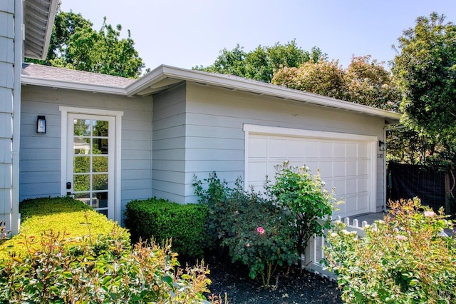 view of property exterior with a garage