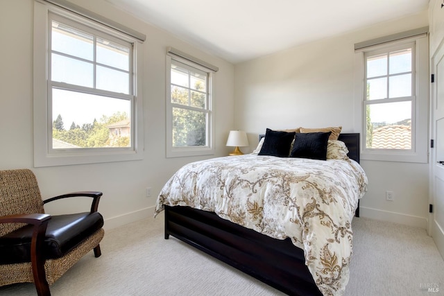 carpeted bedroom with baseboards