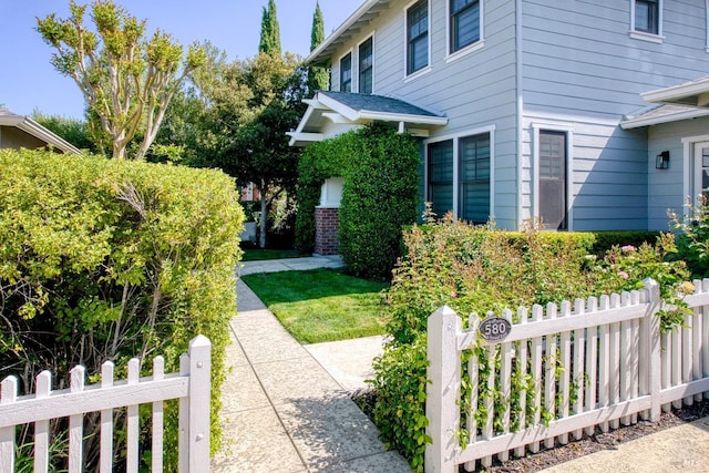view of home's exterior with fence