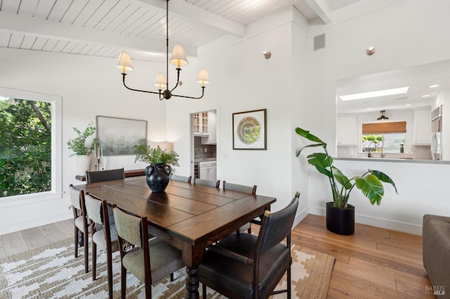 271 Via La Paz Rd, Greenbrae, CA 94904 - dining space with an inviting chandelier, baseboards, hardwood / wood-style floors, and beam ceiling