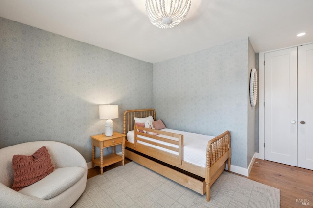 271 Via La Paz Rd, Greenbrae, CA 94904 - bedroom featuring light wood finished floors, wallpapered walls, a closet, and baseboards