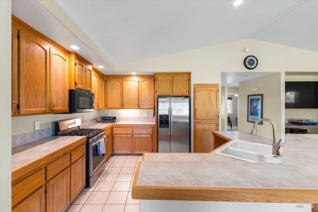 19475 Old Creek Rd, Hidden Valley Lake, CA 95467 - kitchen with stainless steel appliances, a sink, lofted ceiling, tile countertops, and light tile patterned floors