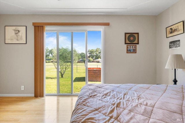 19475 Old Creek Rd, Hidden Valley Lake, CA 95467 - bedroom with wood finished floors, access to outside, and baseboards