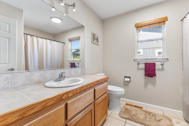 19475 Old Creek Rd, Hidden Valley Lake, CA 95467 - full bathroom with vanity, toilet, plenty of natural light, and tile patterned floors