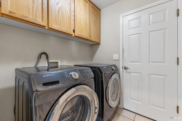 19475 Old Creek Rd, Hidden Valley Lake, CA 95467 - laundry area with cabinet space, washing machine and dryer, and light tile patterned floors