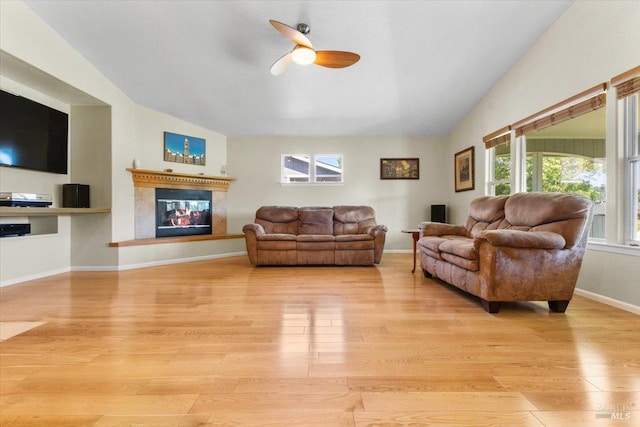19475 Old Creek Rd, Hidden Valley Lake, CA 95467 - living area featuring light wood-style flooring, ceiling fan, healthy amount of natural light, a premium fireplace, and vaulted ceiling