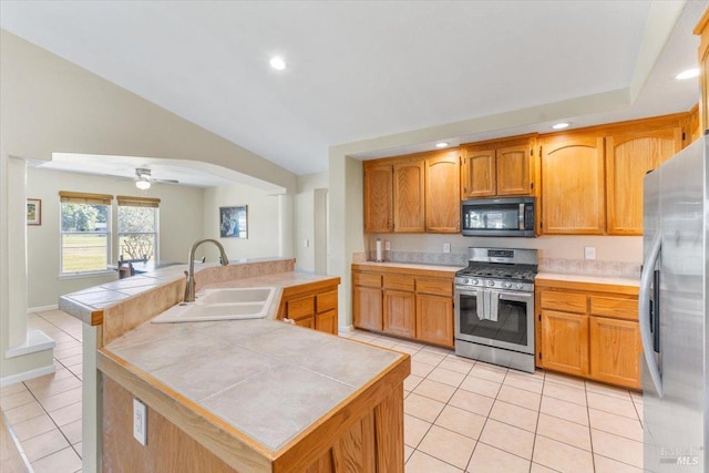 19475 Old Creek Rd, Hidden Valley Lake, CA 95467 - kitchen featuring stainless steel appliances, a sink, light tile patterned floors, tile counters, and recessed lighting