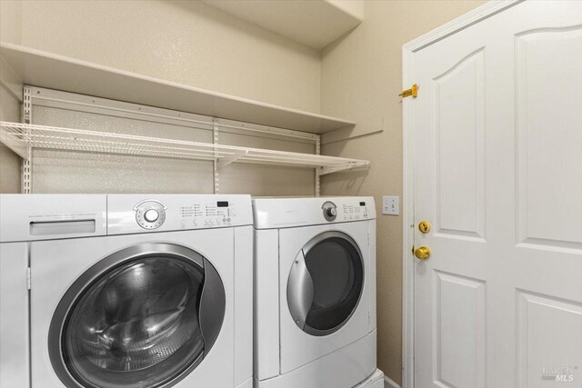 laundry room featuring independent washer and dryer