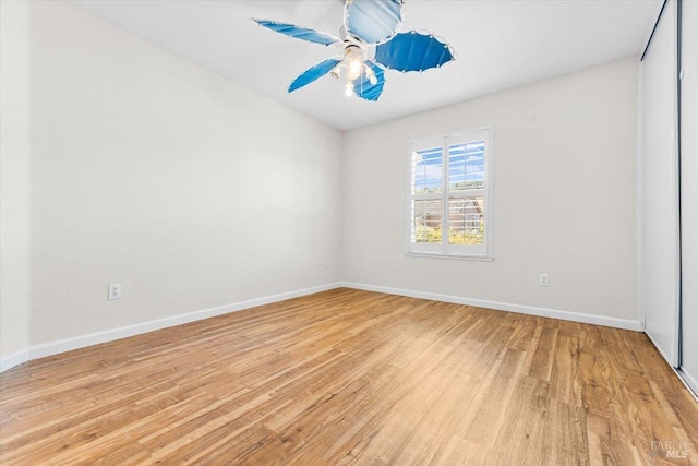 empty room with light wood-style flooring and baseboards