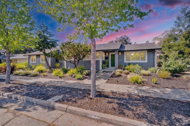 single story home featuring an attached garage