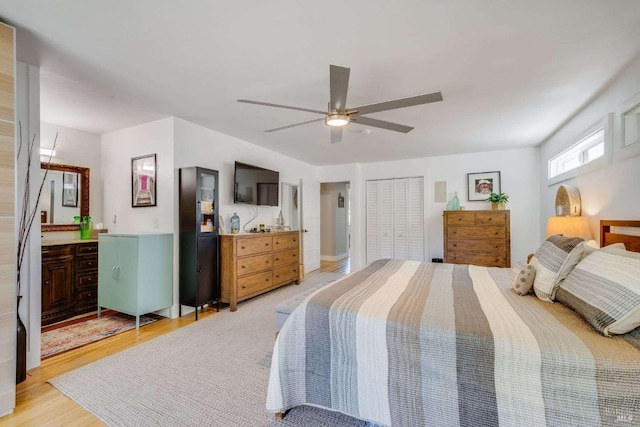 bedroom featuring light wood-style floors and ceiling fan