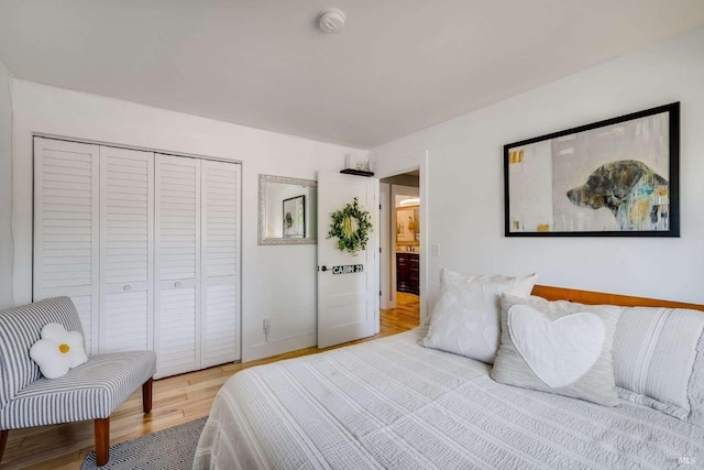 bedroom featuring a closet and wood finished floors