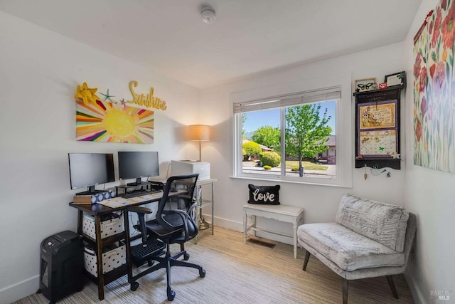 office with baseboards and wood finished floors