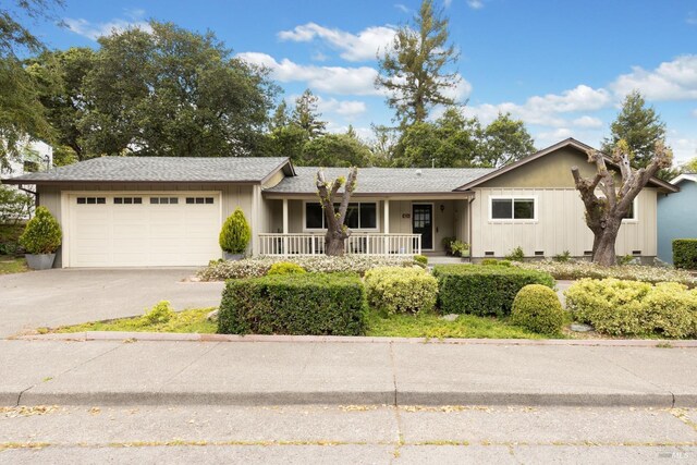 824 W St, Petaluma, CA 94952 - ranch-style home featuring a porch, a garage, concrete driveway, and crawl space
