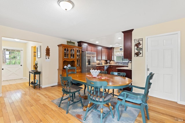 824 W St, Petaluma, CA 94952 - dining room featuring light wood-style floors and baseboards