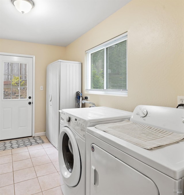 824 W St, Petaluma, CA 94952 - laundry room featuring separate washer and dryer, light tile patterned floors, and baseboards