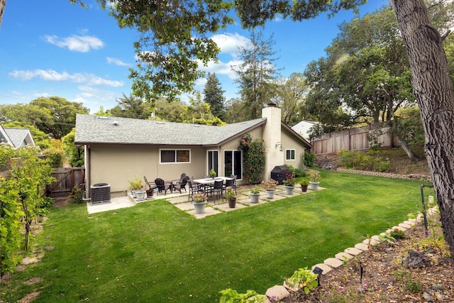 824 W St, Petaluma, CA 94952 - rear view of house featuring a patio area, stucco siding, a chimney, and central air condition unit