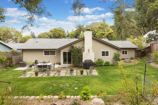 824 W St, Petaluma, CA 94952 - rear view of property featuring a patio area, a chimney, stucco siding, and central AC