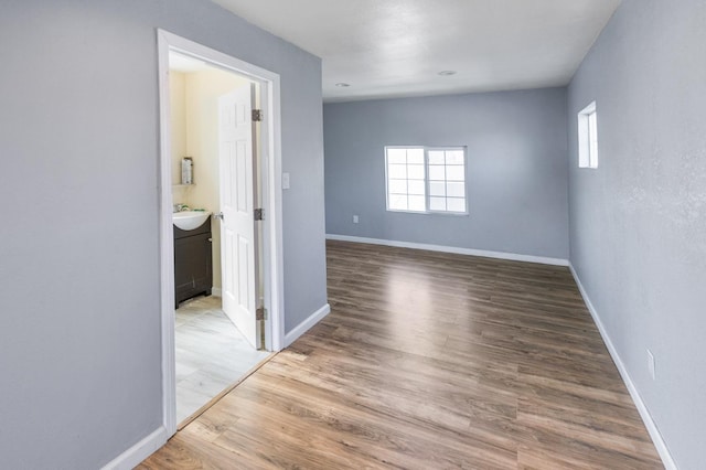 2931 Elm Ave, Merced, CA 95348 - unfurnished room with a sink, wood finished floors, and baseboards