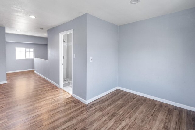 2931 Elm Ave, Merced, CA 95348 - unfurnished room with wood finished floors, baseboards, and recessed lighting