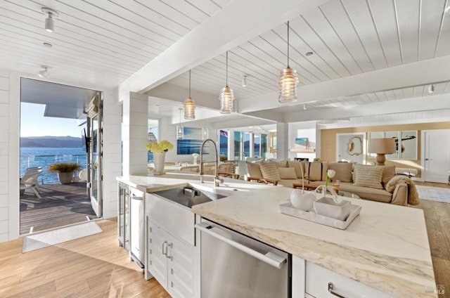 27 W Shore Rd, Belvedere, CA 94920 - kitchen with dishwasher, a sink, light wood-type flooring, white cabinets, and decorative light fixtures