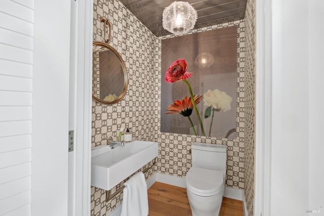 27 W Shore Rd, Belvedere, CA 94920 - bathroom with wallpapered walls, wood finished floors, toilet, and a sink