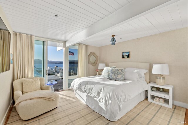 27 W Shore Rd, Belvedere, CA 94920 - bedroom featuring a wall of windows, access to exterior, baseboards, beamed ceiling, and a water view