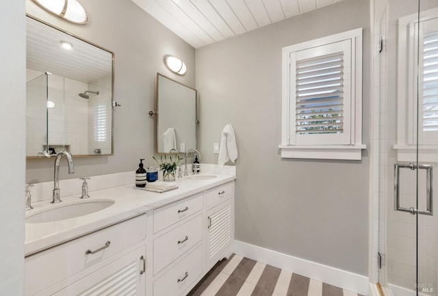 27 W Shore Rd, Belvedere, CA 94920 - bathroom featuring a shower stall, double vanity, and baseboards