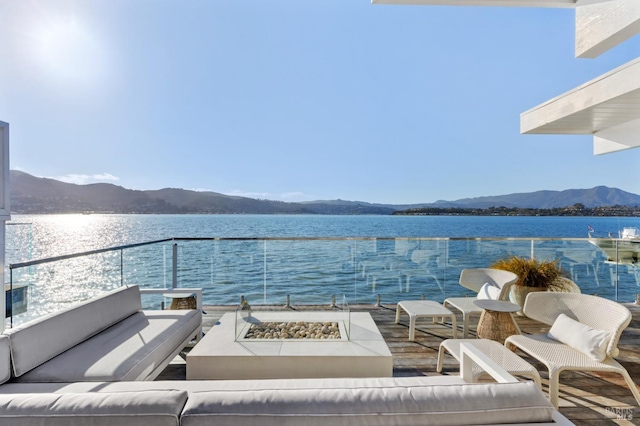27 W Shore Rd, Belvedere, CA 94920 - view of patio featuring a water and mountain view and an outdoor living space with a fire pit